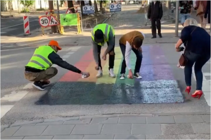 Rainbow crossing covered with black paint